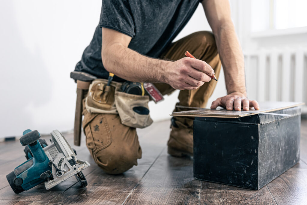 circular saw, carpenter using a circular saw for wood.